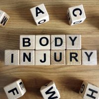 Text body injury from wooden blocks on desk