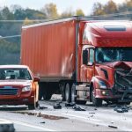 the moment of collision between a semi truck with a box trailer and a passenger car