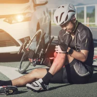 cyclist-in-gear-sits-on-the-road